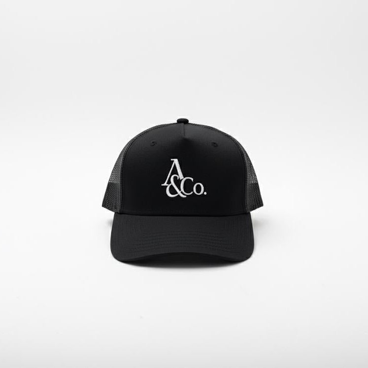 Black cap with 'A&Co.' logo on a white background